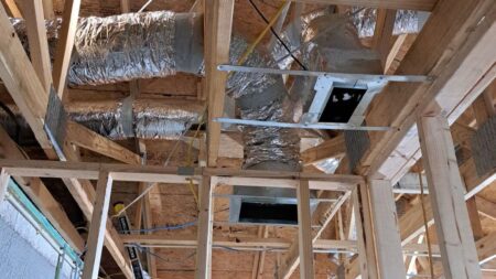 New residential HVAC ductwork installed during home construction with insulated supply ducts