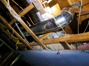 Galvanized HVAC supply duct installed in the attic as part of a residential duct system upgrade