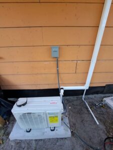 Daizuki ductless mini split outdoor condenser installed on a concrete equipment pad