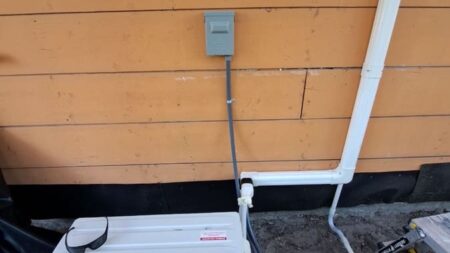 Daizuki ductless mini split outdoor condenser installed on a concrete equipment pad